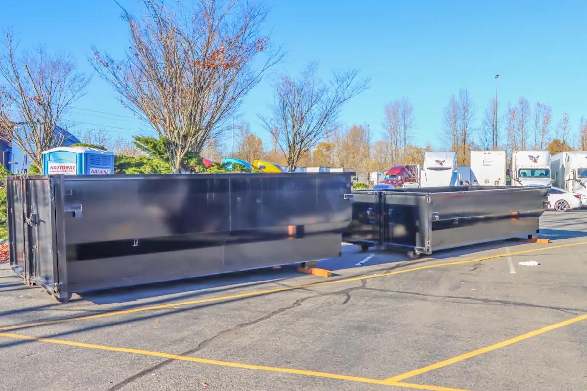 Professional dumpster rental service with roll-off container on residential driveway in Palo Alto